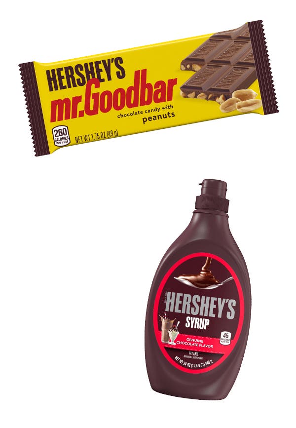 hersheys mr goodbar chocolate with peanuts candy bar beside bottle of hersheys chocolate syrup
