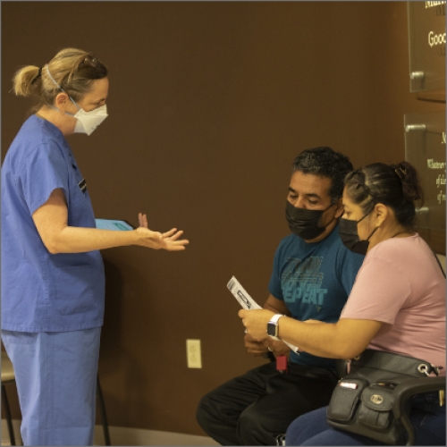 healthcare worker speaking with patients