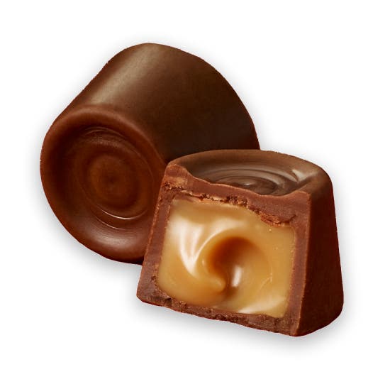 pair of unwrapped rolo creamy caramels in rich chocolate candy