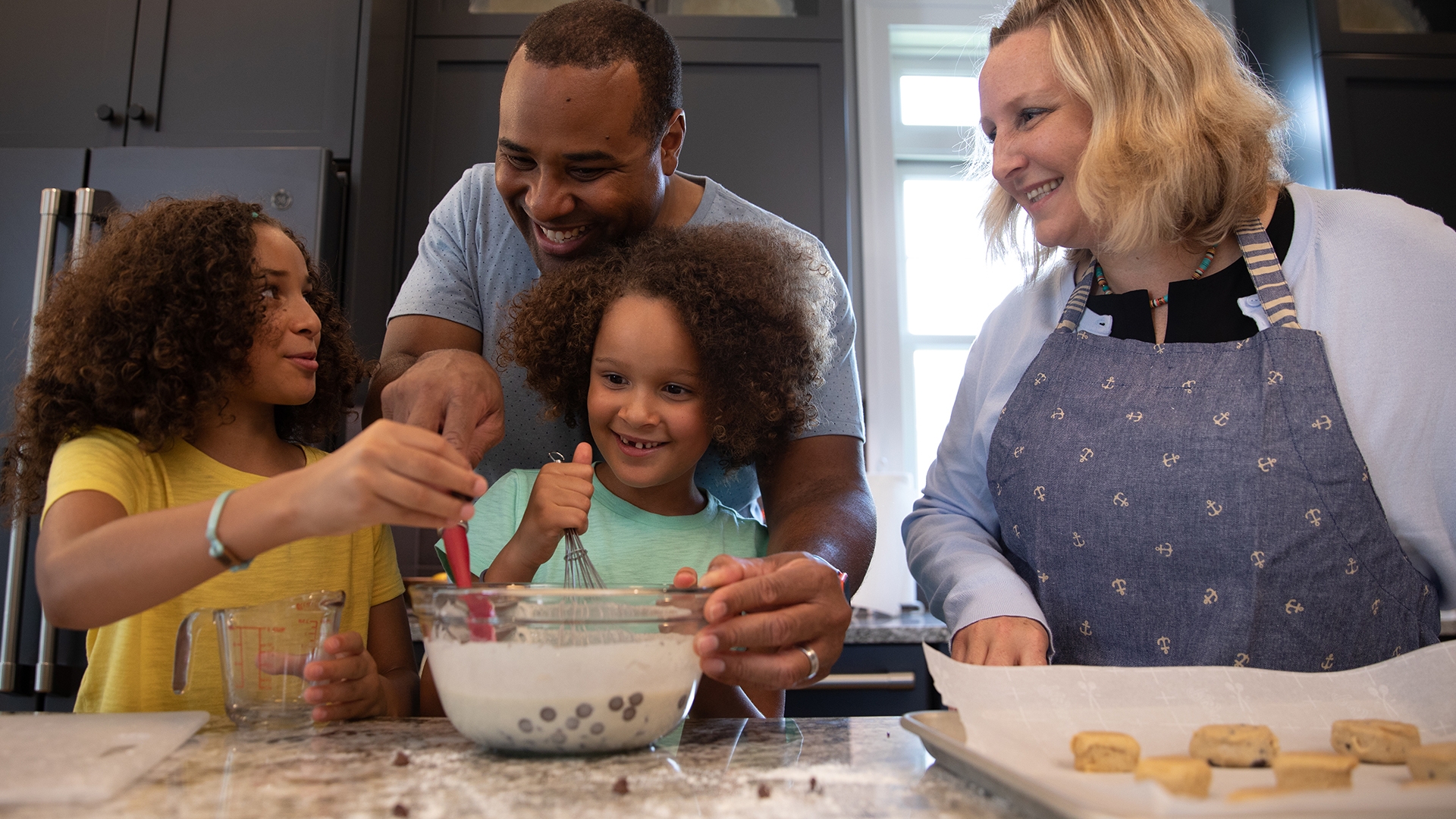 image of family cooking together