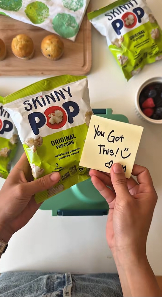 lunchbox note next to bags of skinny pop