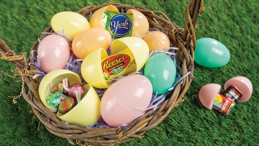 Easter eggs with candy in a basket