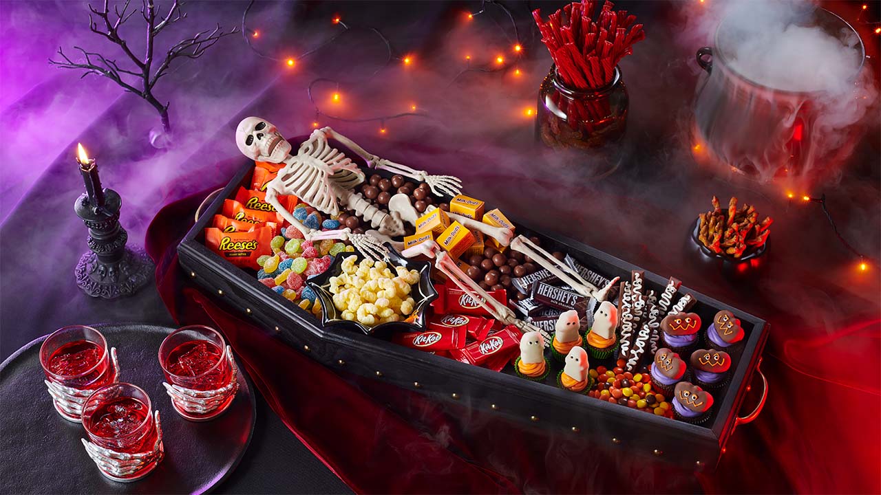 halloween candy dish filled with assorted hersheys candy