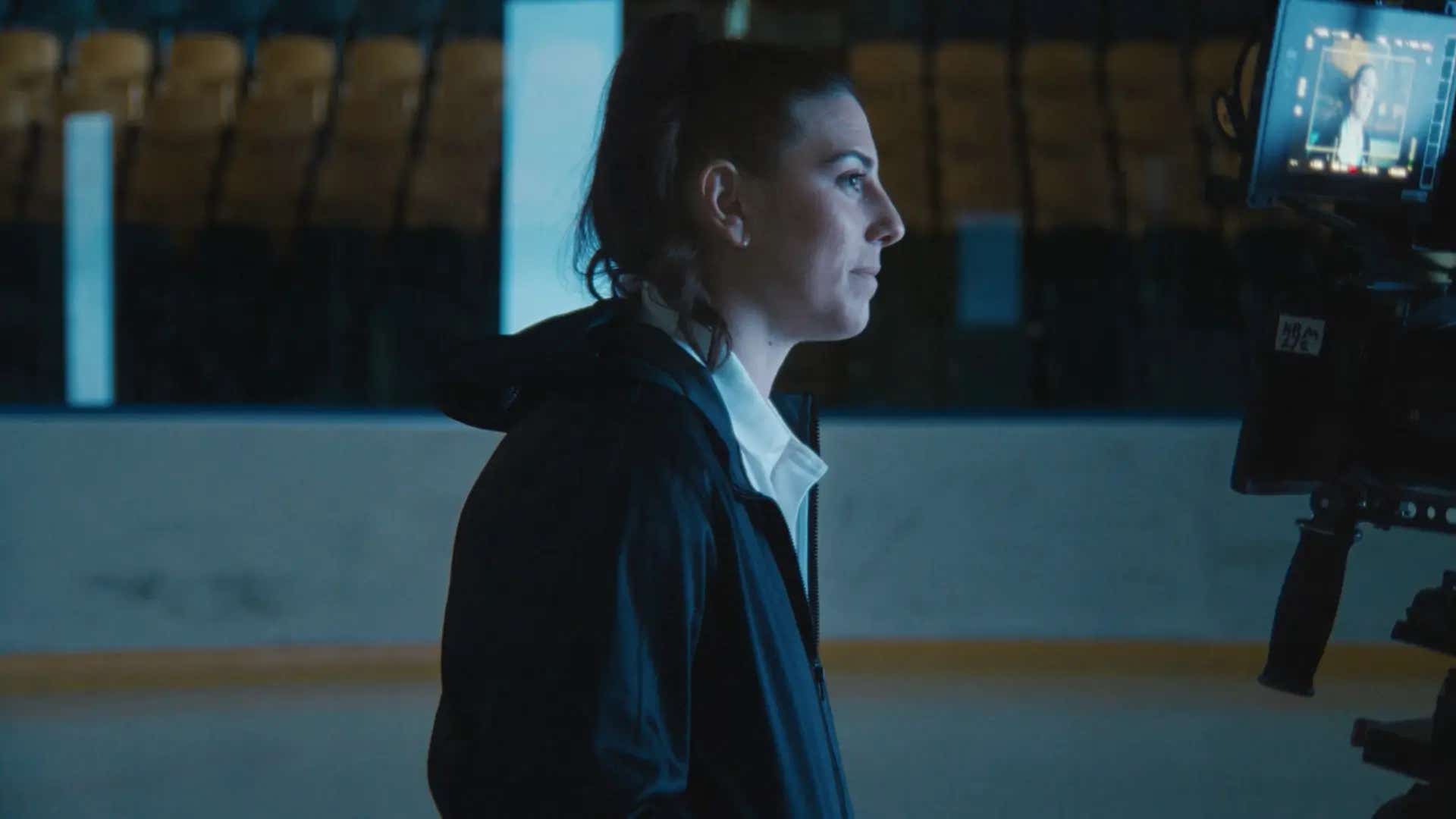 ice hockey player hilary knight being interviewed from the ice rink