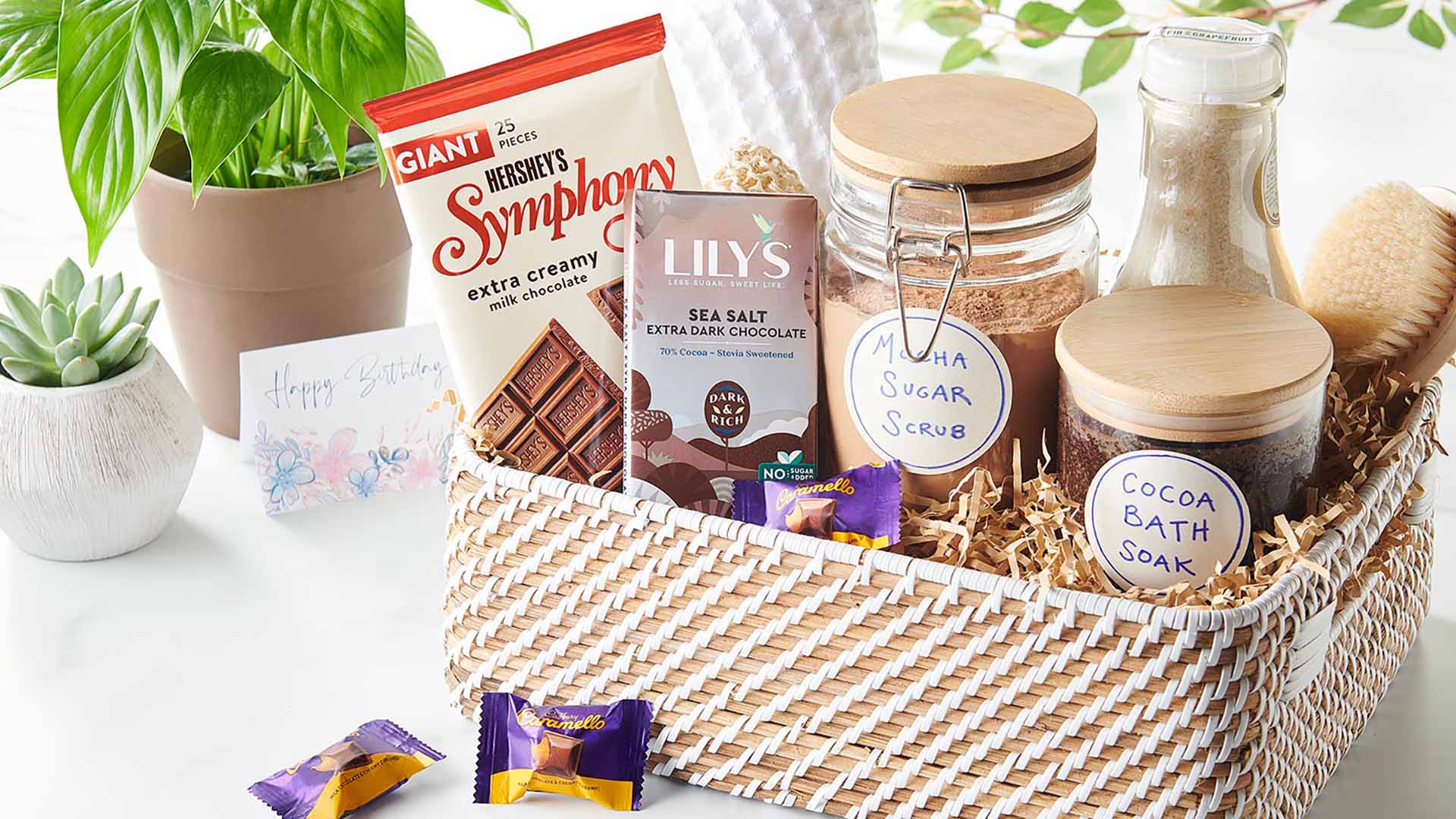 gift basket filled with hersheys candy and spa necessities