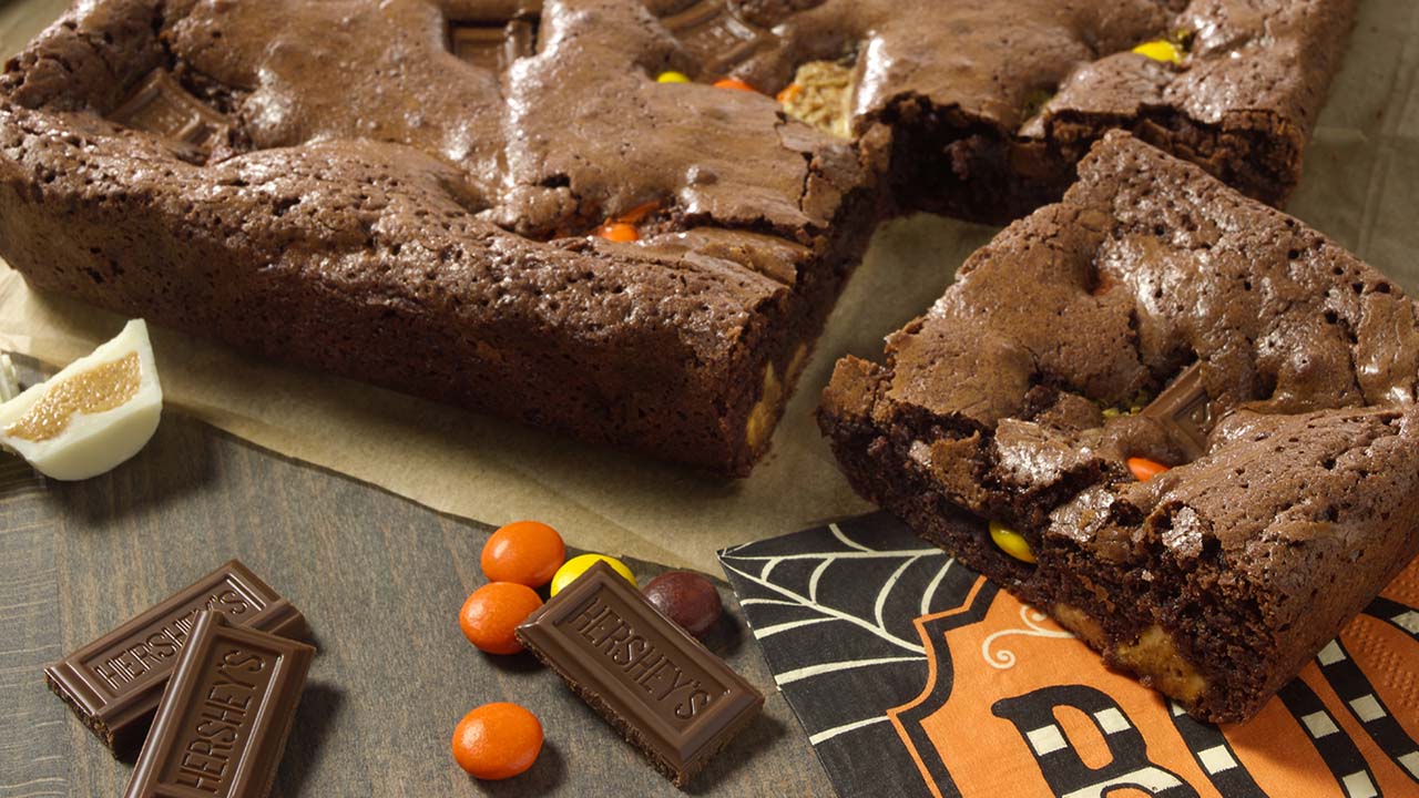 Chocolate brownies stuffed with leftover halloween candy