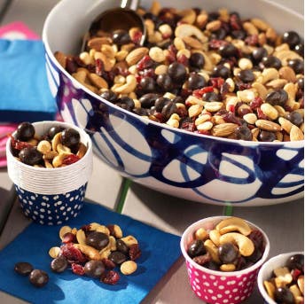 homemade party mix made in a bowl with little serving cups