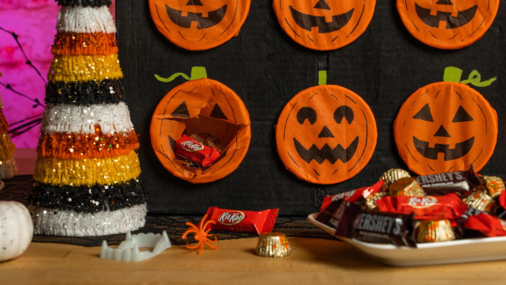 poke a pumpkin game with one pumpkin broken open with candy falling out