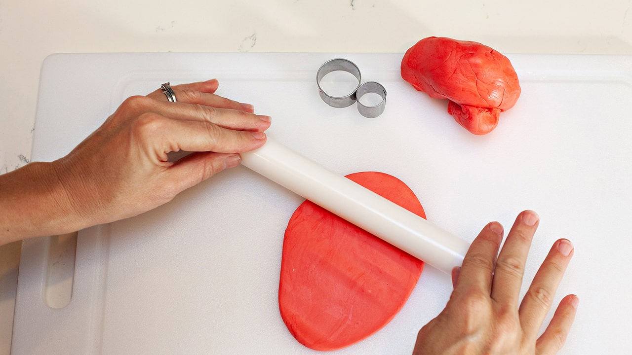 rolling out the fondant dough