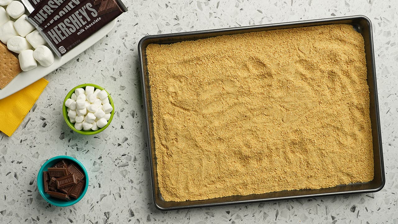 graham cracker "sand" spread over tray