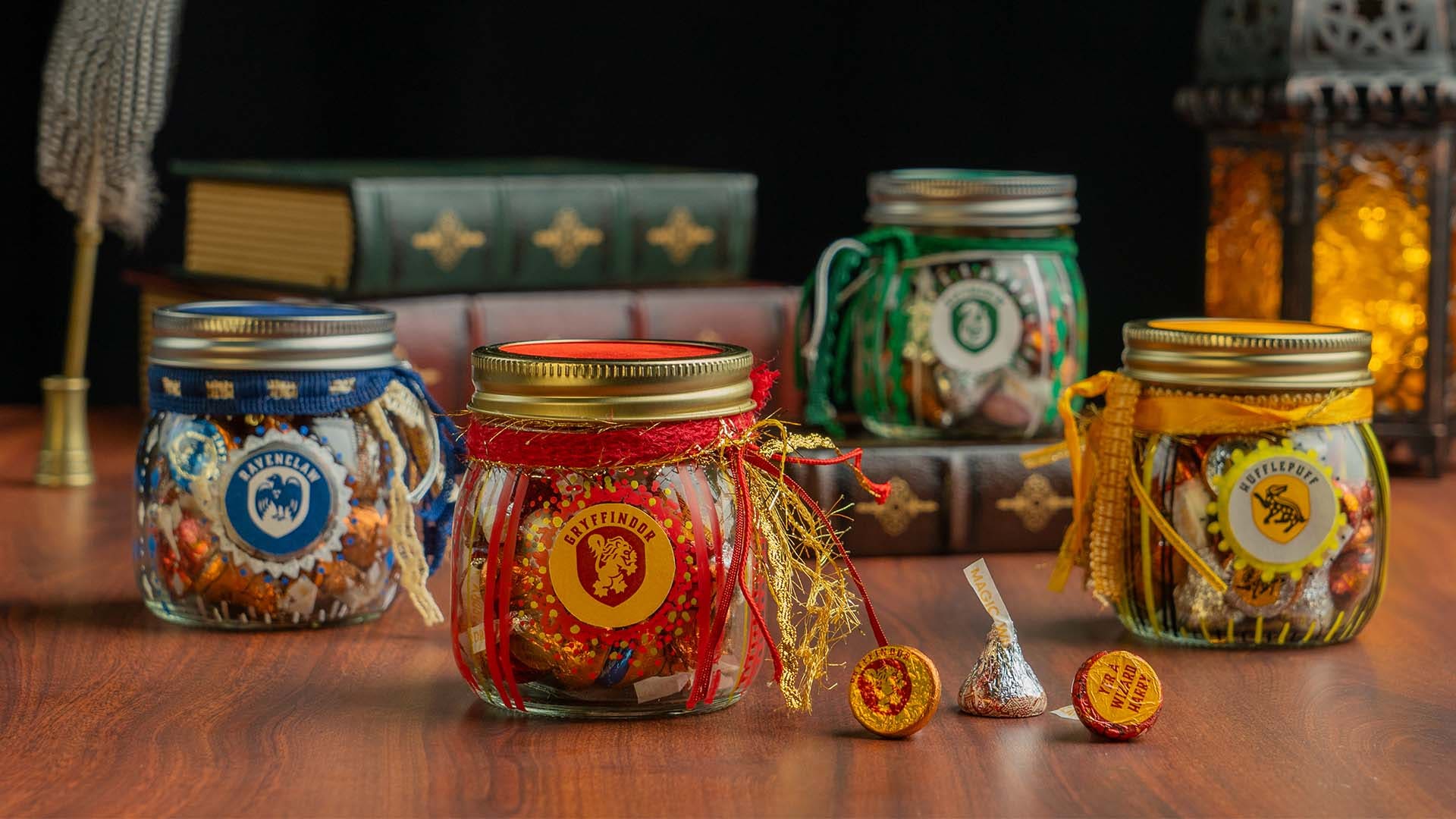 full set of hogwarts house candy gift jars filled with hersheys kisses