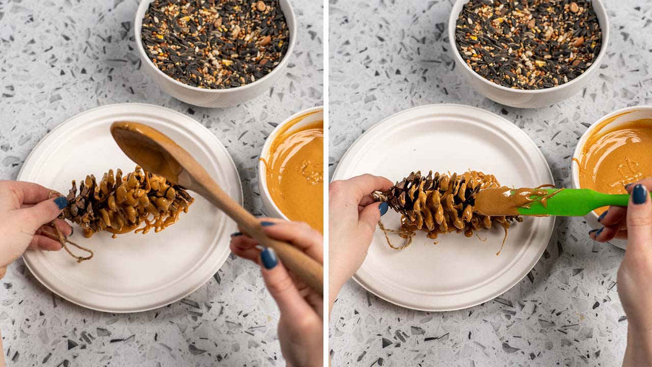 coating the pinecone and apple in reeses peanut butter with a spoon and rubber scraper