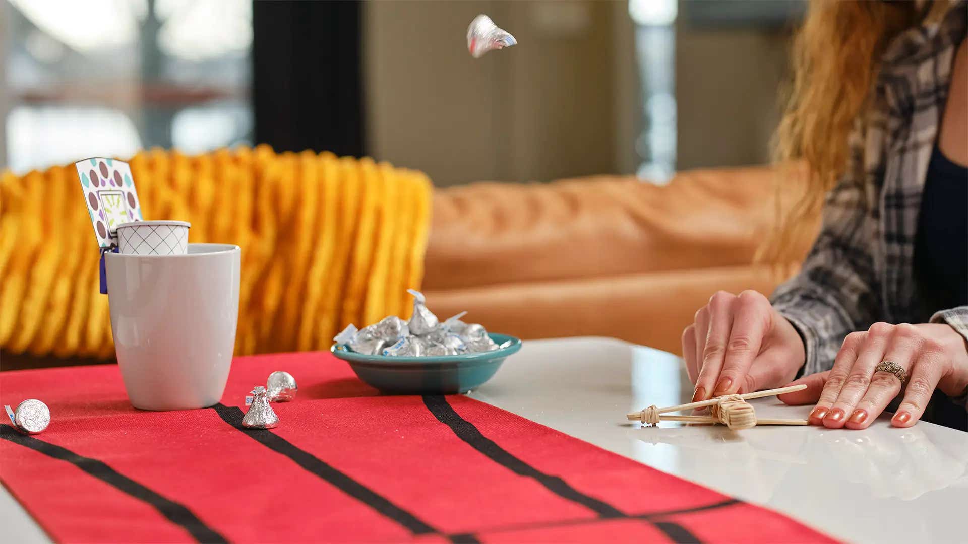 launching hershey kisses into mug basketball hoop