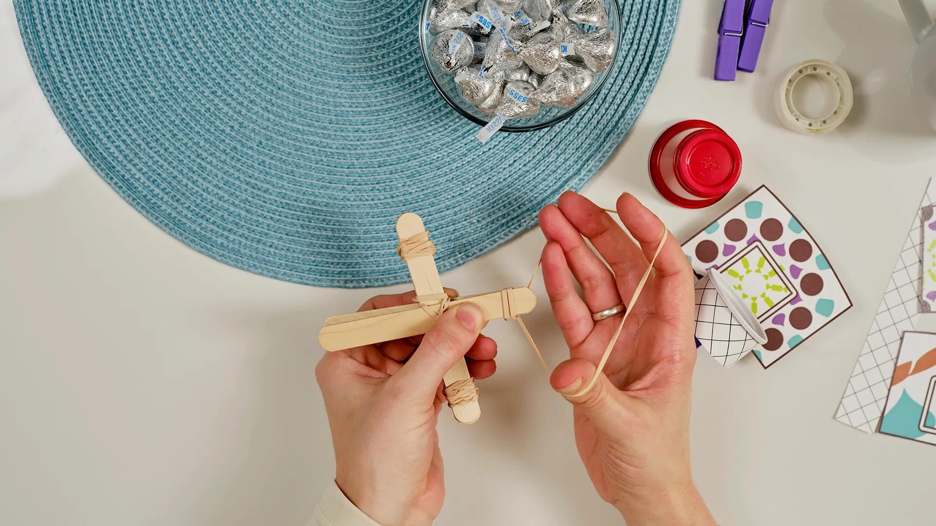 wrap popsicle sticks in rubber bands