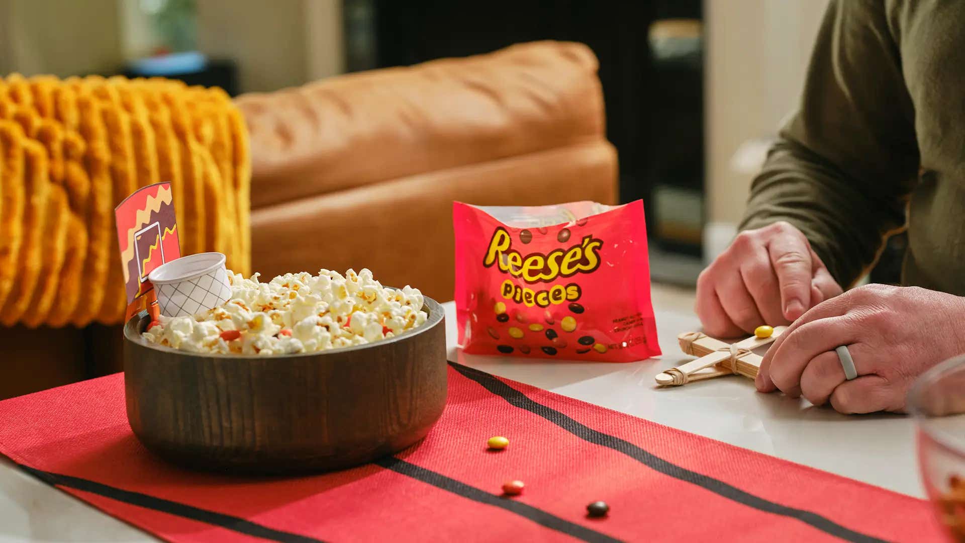 launching reeses pieces into mug basketball hoop