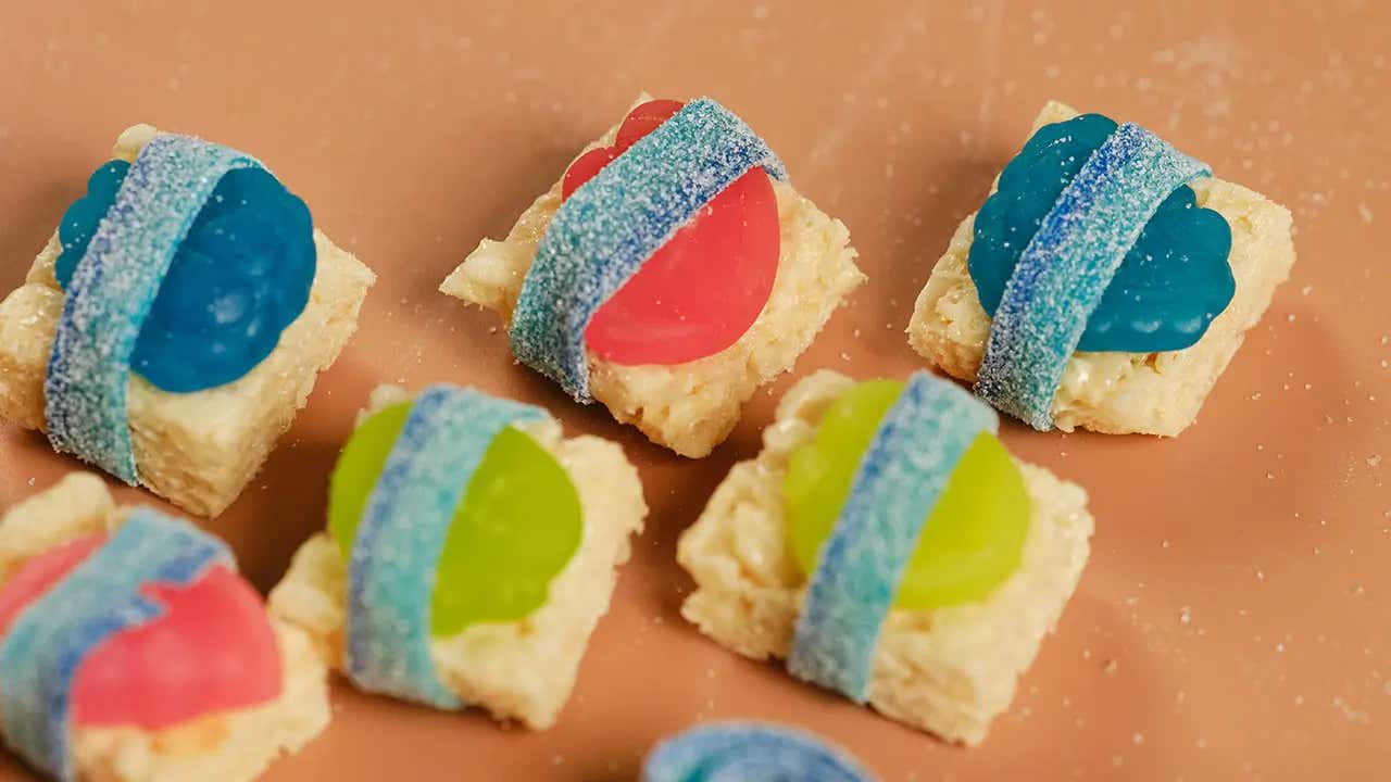 sour strips wrapped around cereal treat and gummy