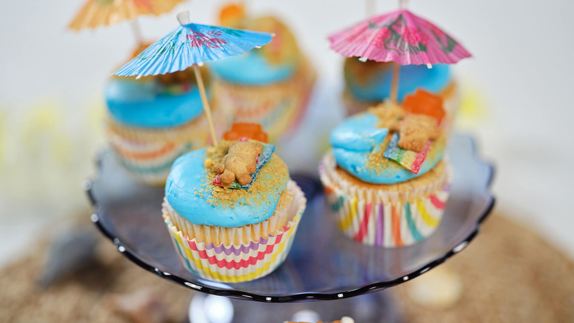 tray topped with beach day cupcakes ready to serve