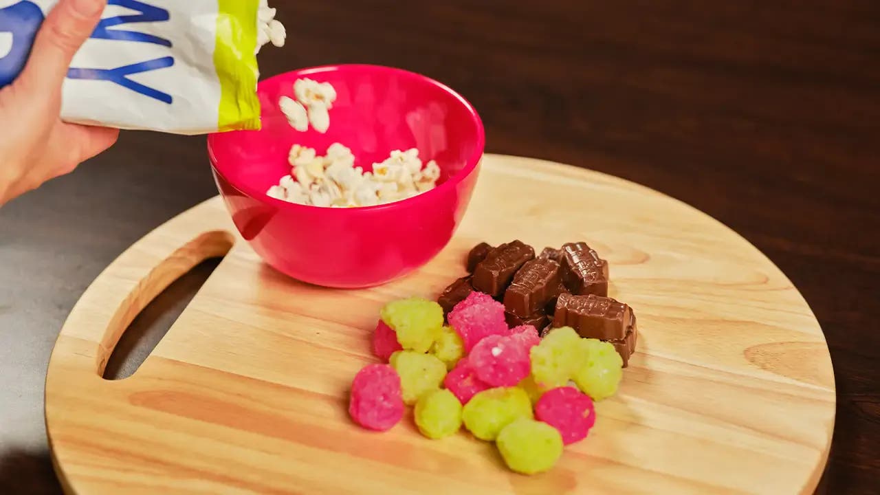 Popcord being poured into a bowl