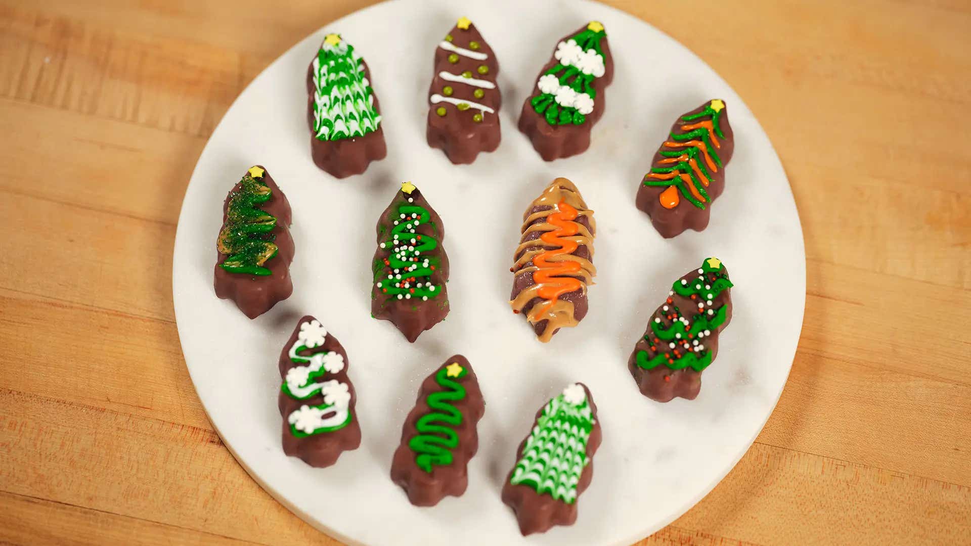overhead view of reeses trees decorated with icing, peanut butter and sprinkles