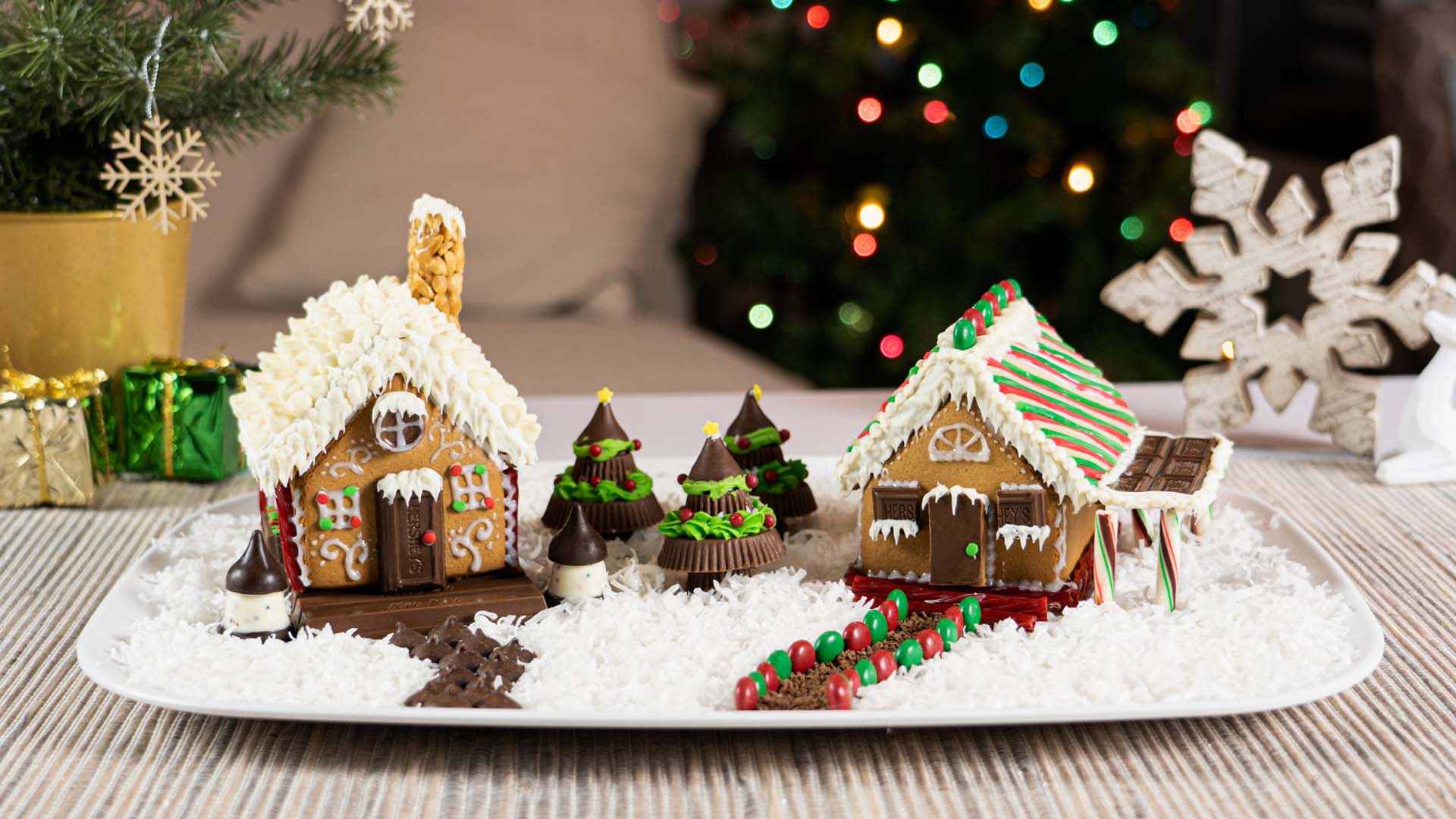 two fully decorated gingerbread houses