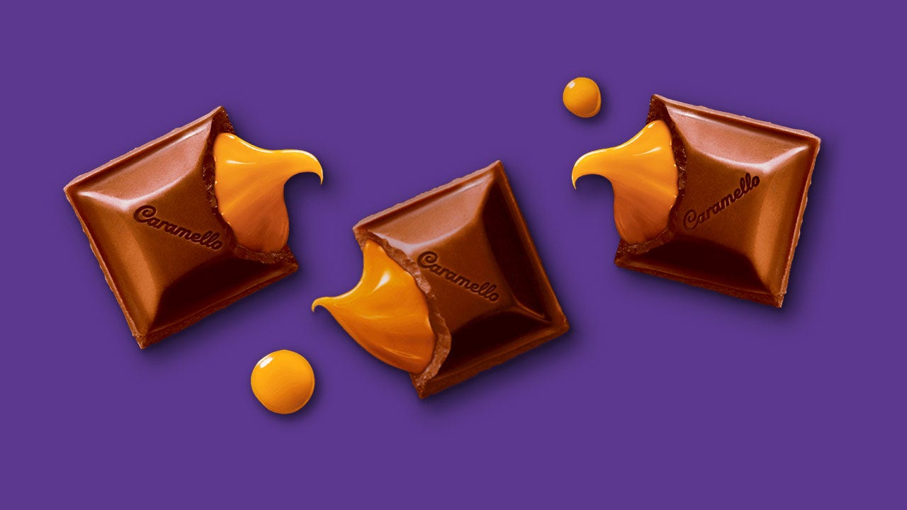 cadbury caramello milk chocolate squares cracked open with caramel pouring out