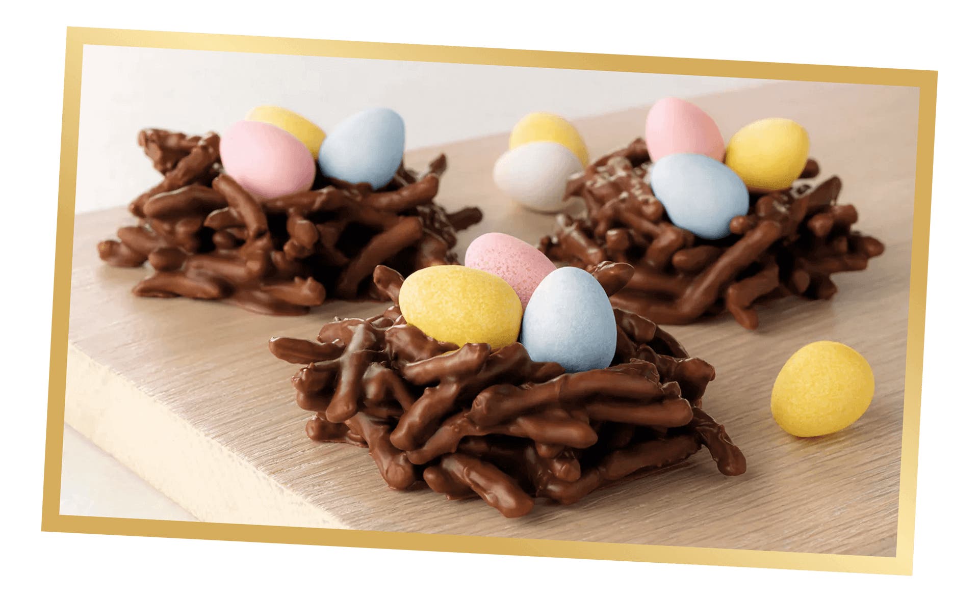 cadbury chocolate eggs in bird nests made of chocolate covered pretzels