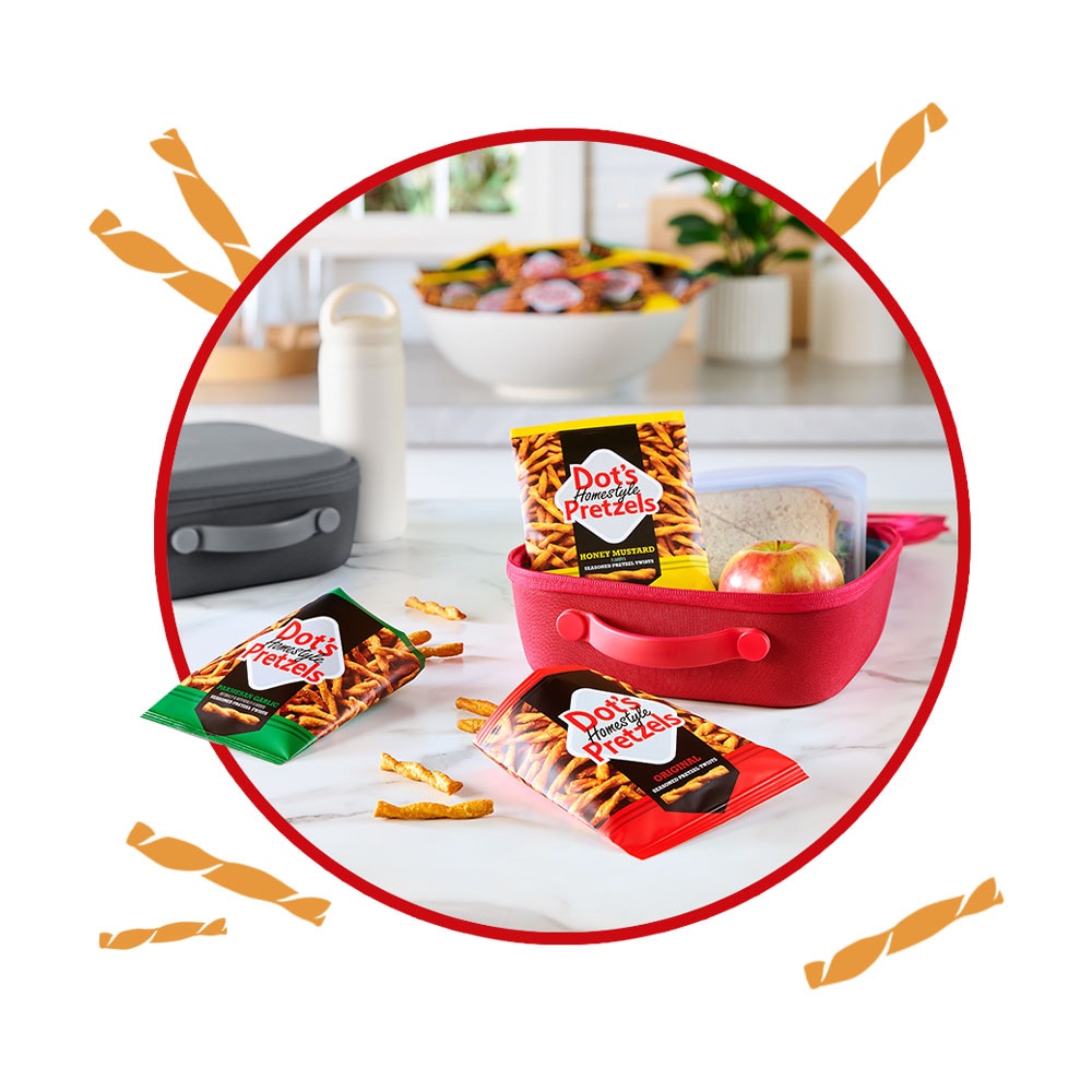 assorted snack size bags of dots homestyle pretzels on counter and inside lunch box
