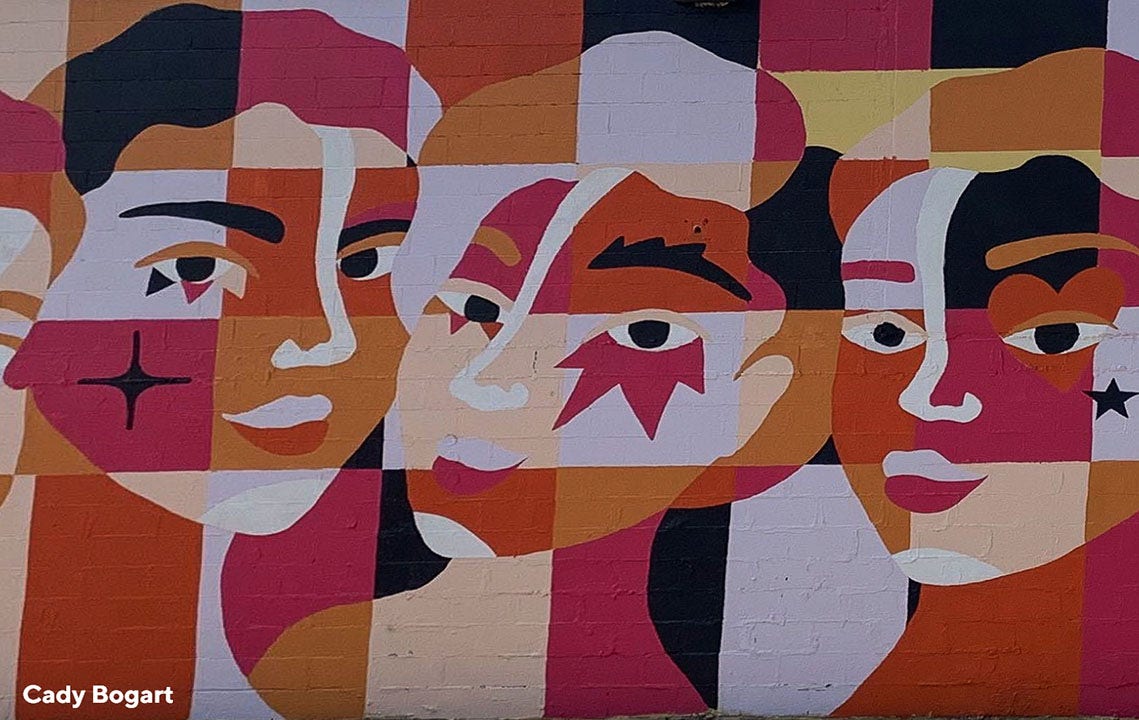 mural of several abstract faces