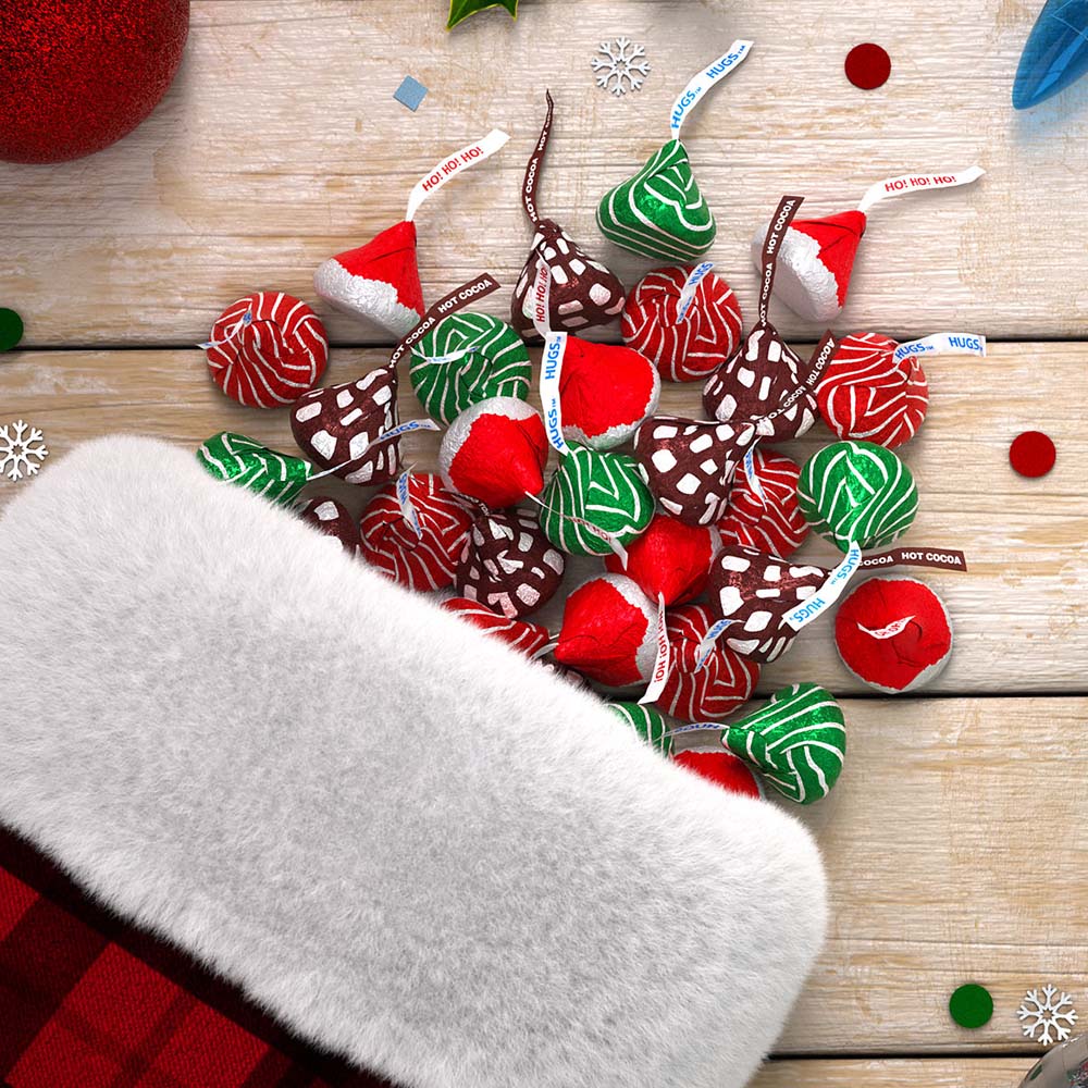 christmas stocking filled with assorted hersheys kisses candy