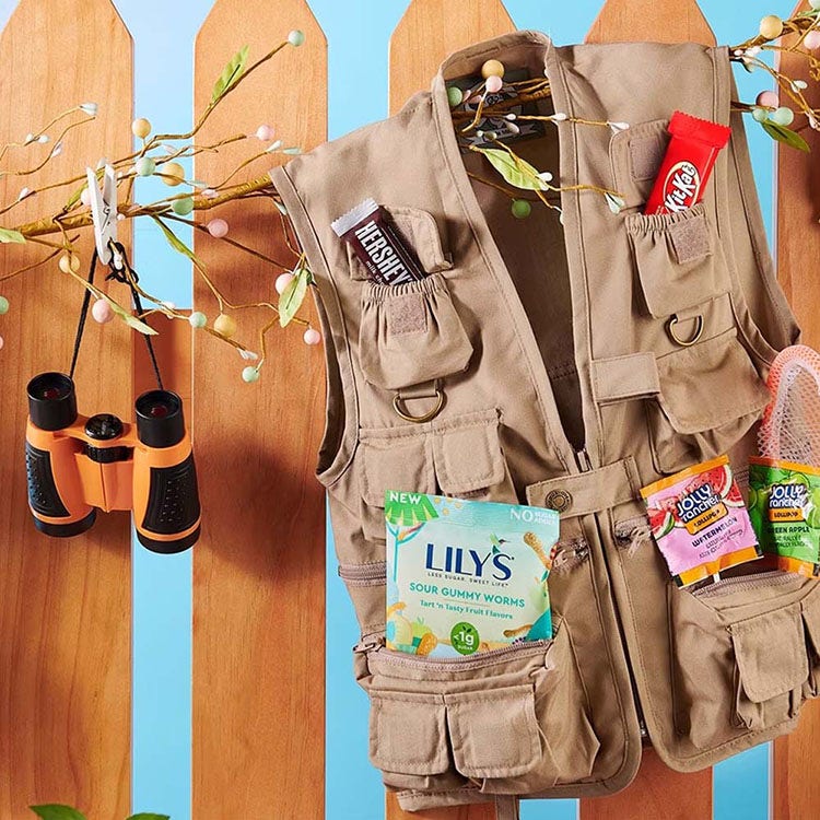 fishing vest filled with assorted hersheys salty snacks and sweet candy