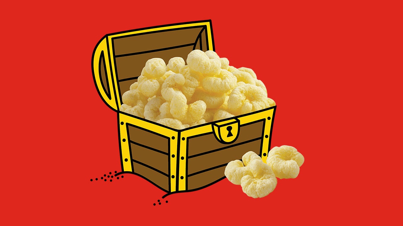 treasure chest overflowing with pirates booty aged white cheddar puffs