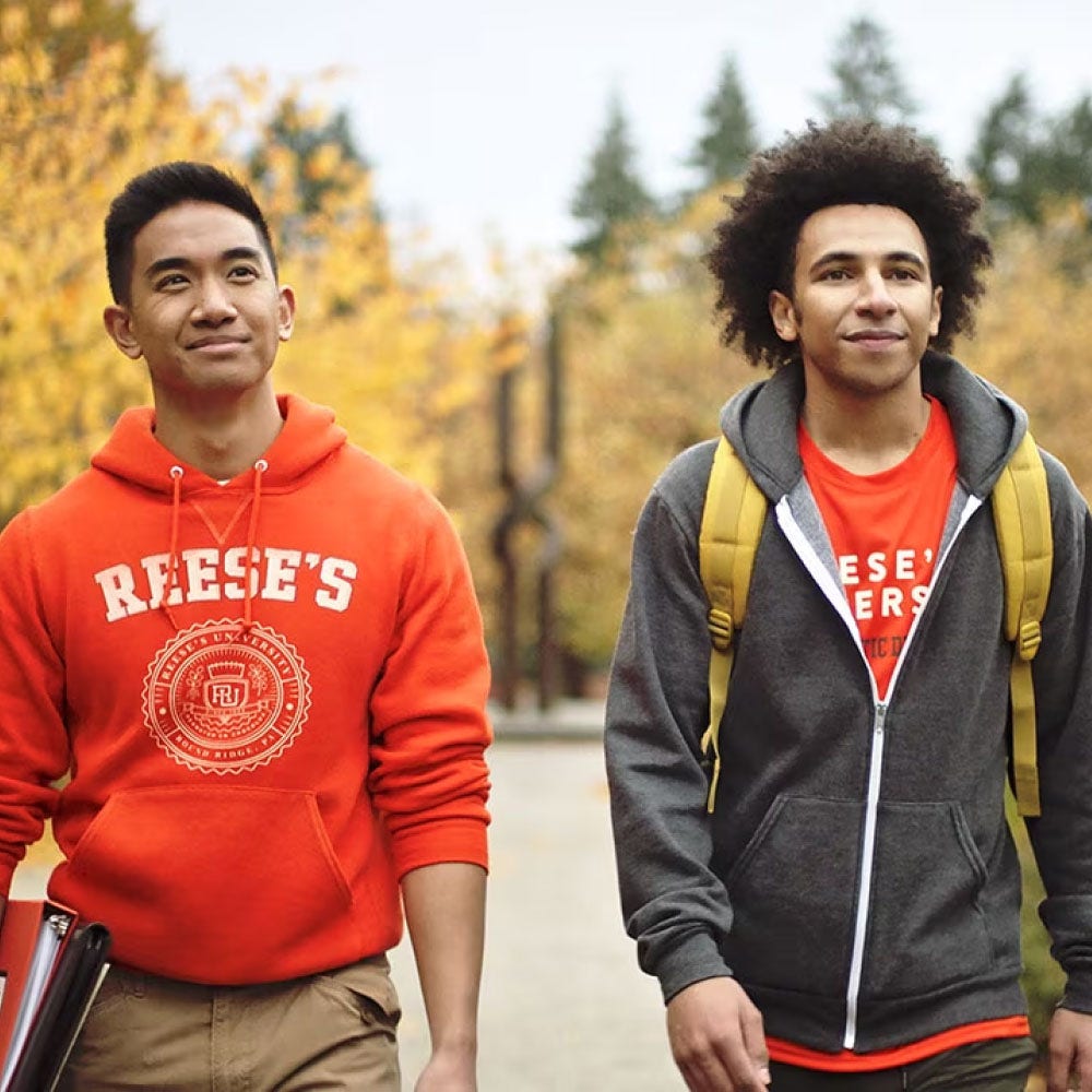 two reeses university students walking on campus