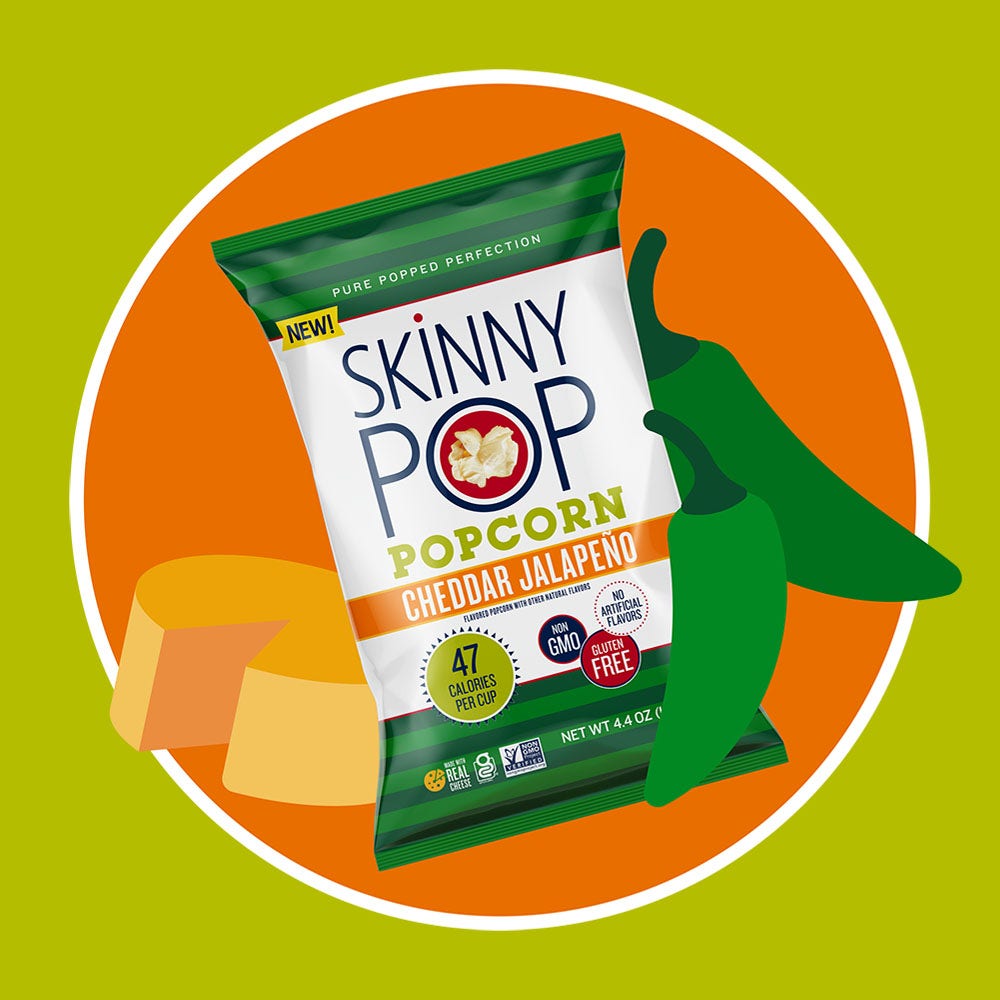 bag of skinnypop cheddar jalapeno popped popcorn beside illustrated cheese wheel and jalapenos
