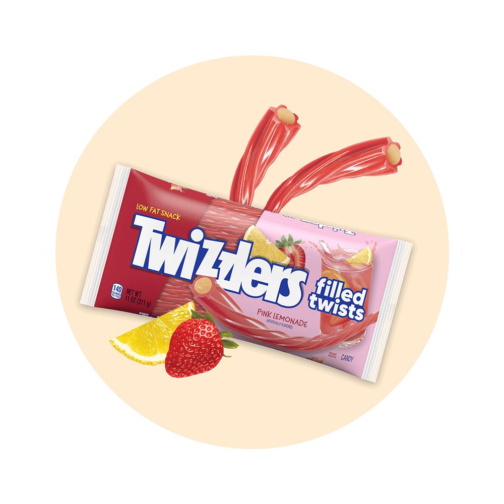 bag of twizzlers pink lemonade filled twists surrounded by fruit and unwrapped twists