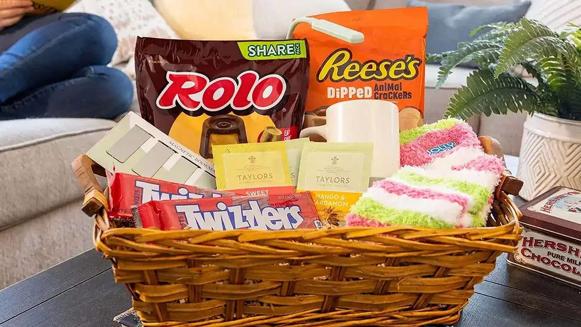 gift basket filled with assorted hersheys candies, candles, and accessories