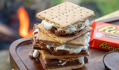 stack of two smores next to reeses cups