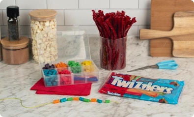 rainbow twizzlers cut into pieces to be used for jewlery crafts