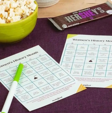 womens history month bingo cards on a table