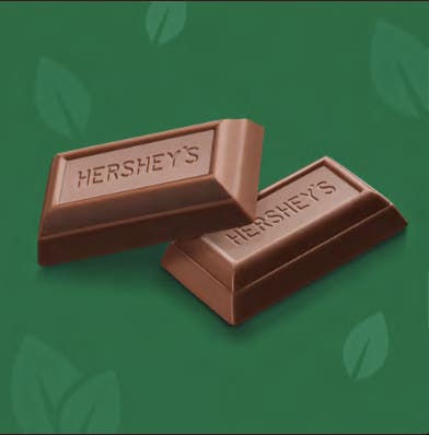 hersheys unwrapped miniature candy with green leaf pattern background