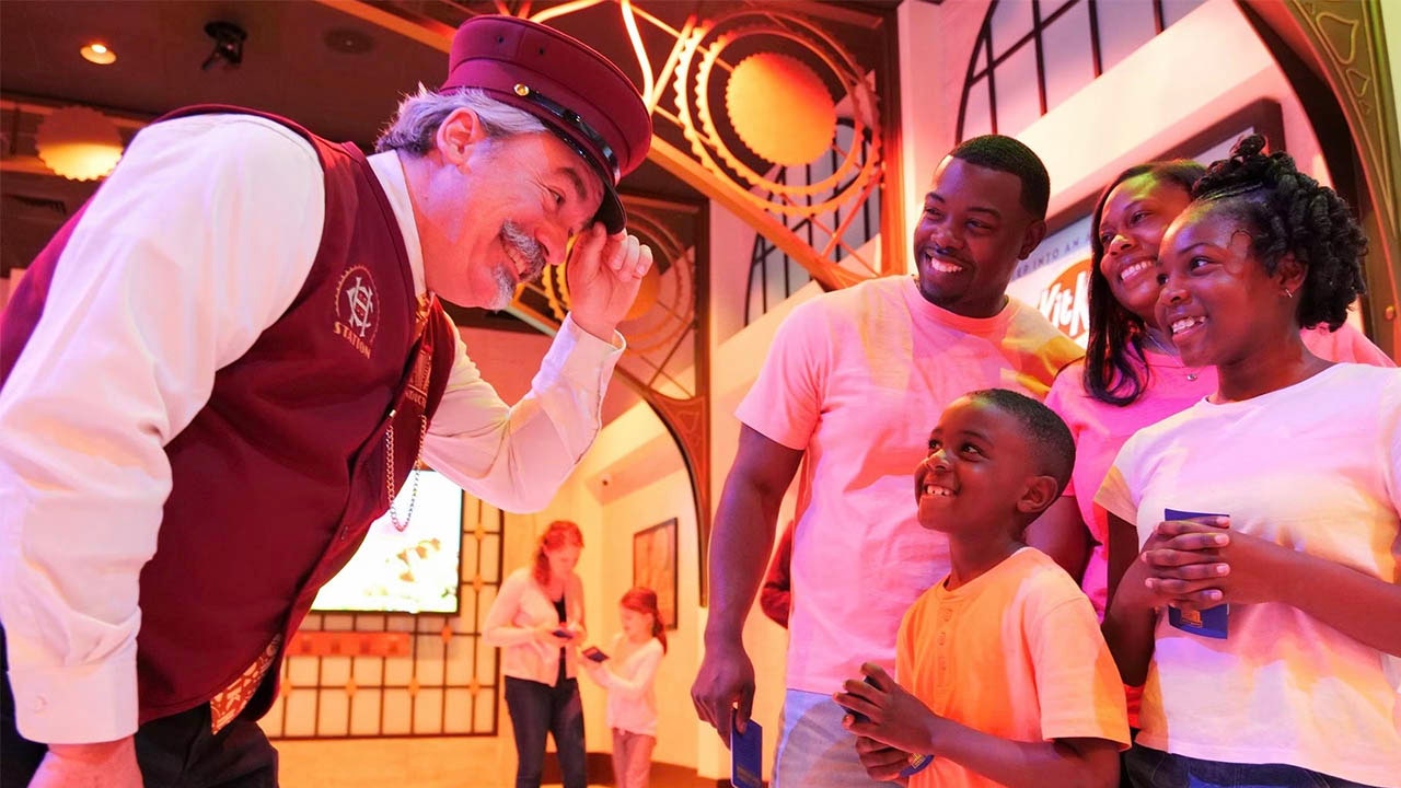 hersheyland express conductor with chocolate world guests