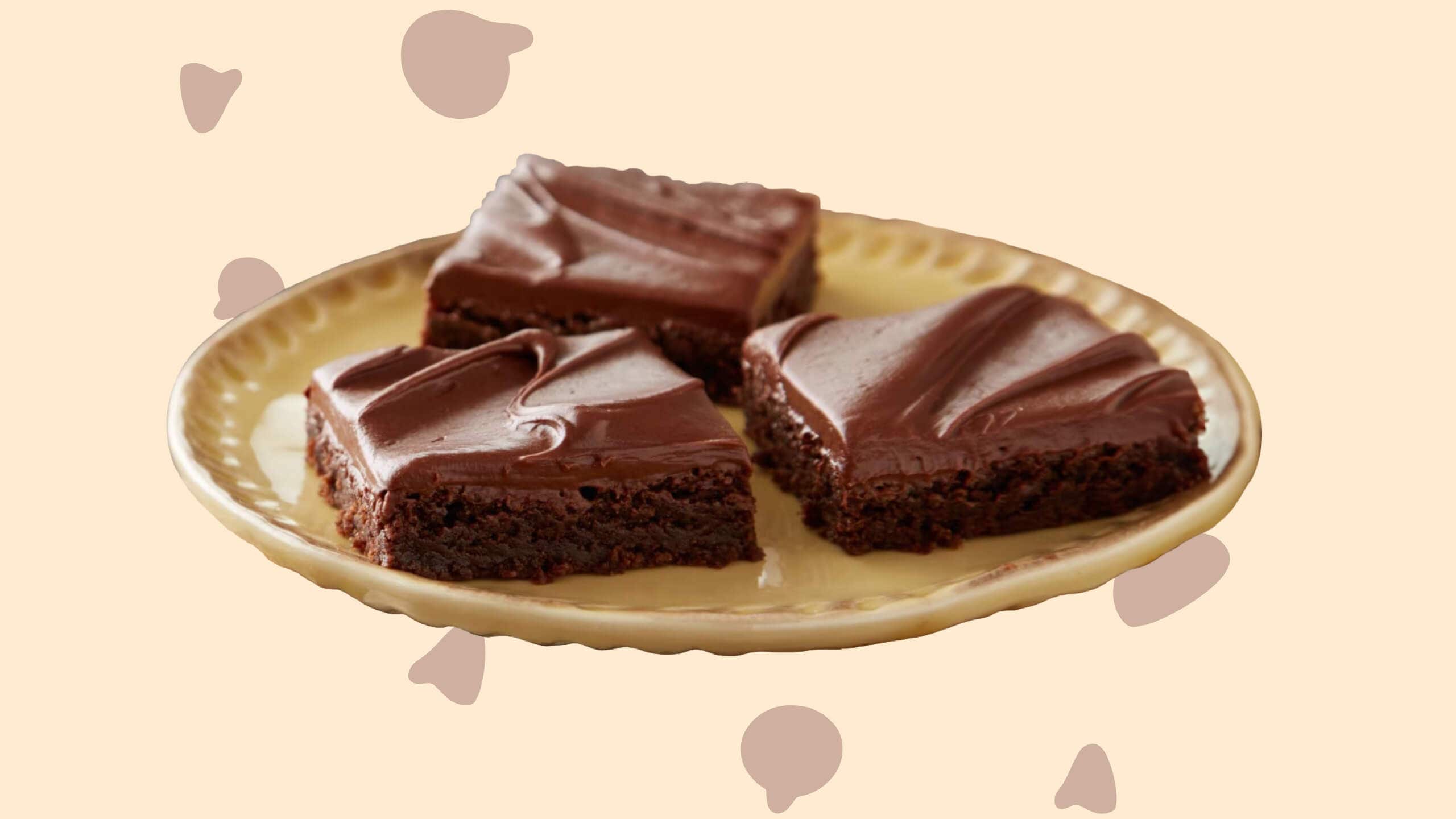 plate with brownie squares topped with hersheys cocoa frosting