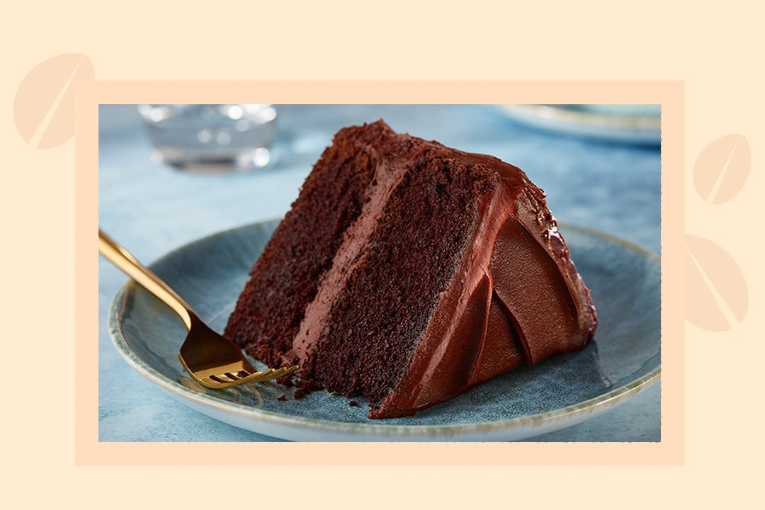 slice of chocolate cake on blue ceramic plate