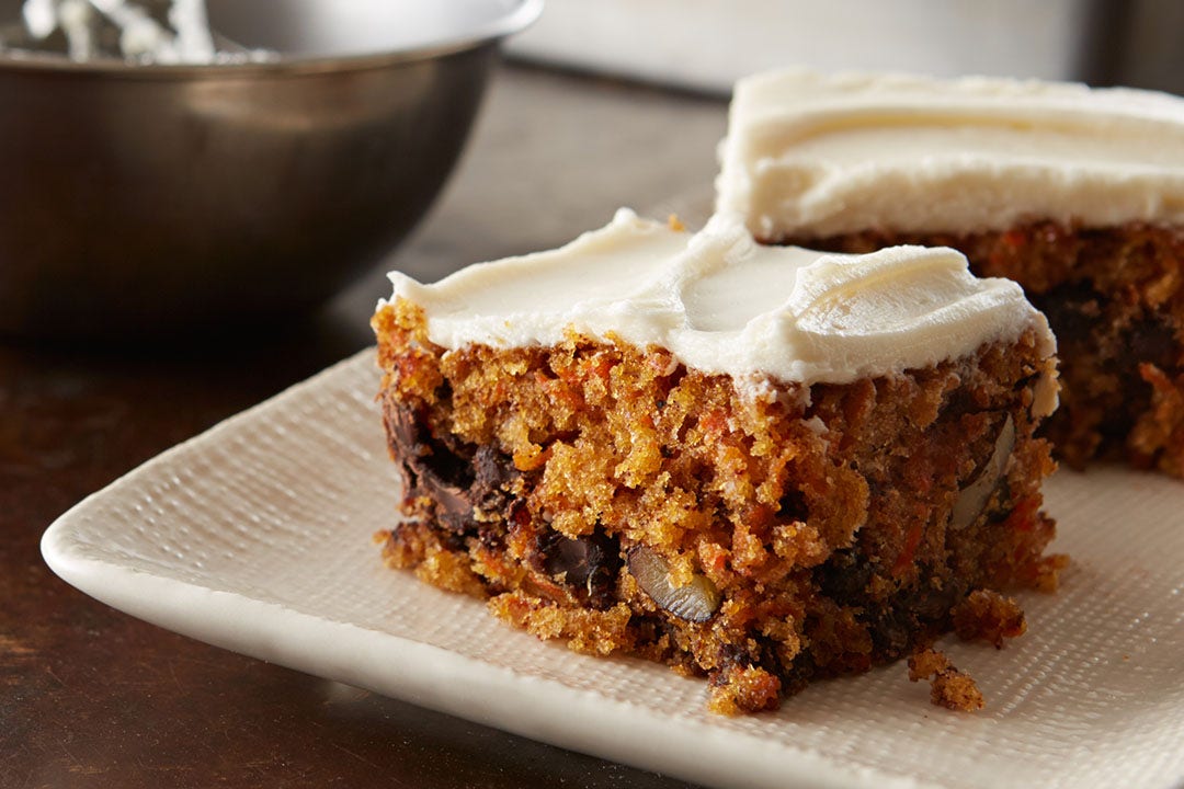 square carrot cake slices on serving plate
