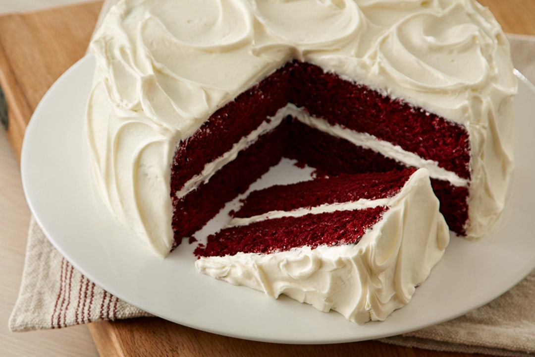 Red velvet cake with cross section slice beside it
