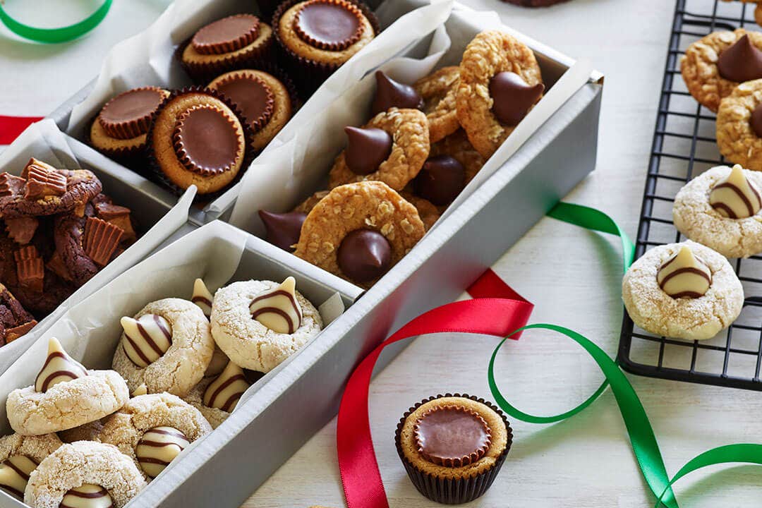holiday gift boxes filled with different types of cookies