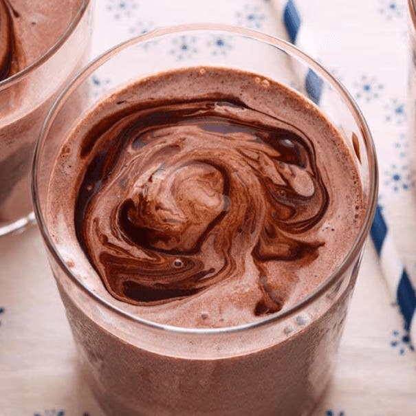 hersheys chocolate milkshake made with swirls of chocolate syrup
