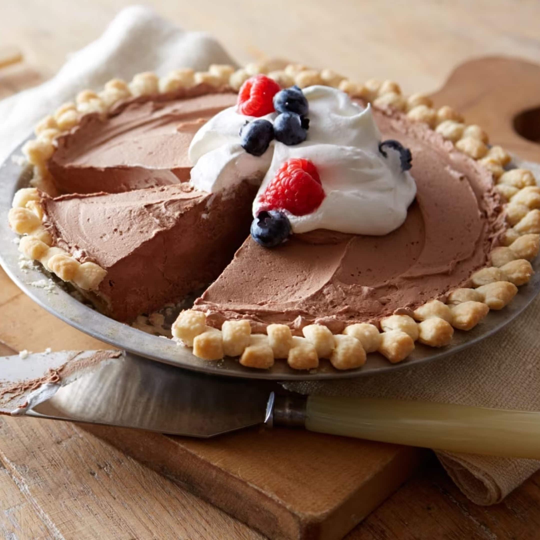 hersheys frosty chocolate chip cookie pie topped with fruit and whipped cream