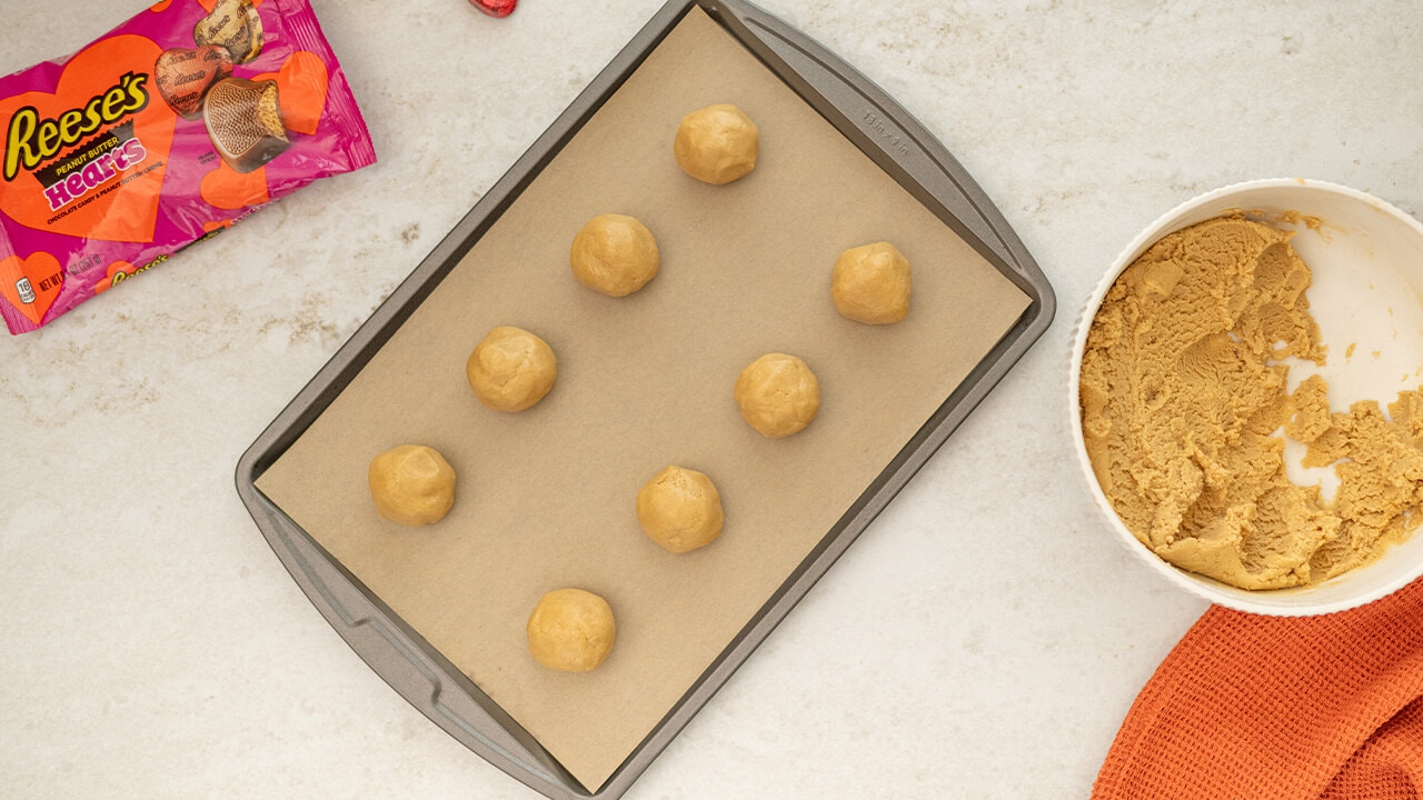 dough balls on baking sheet
