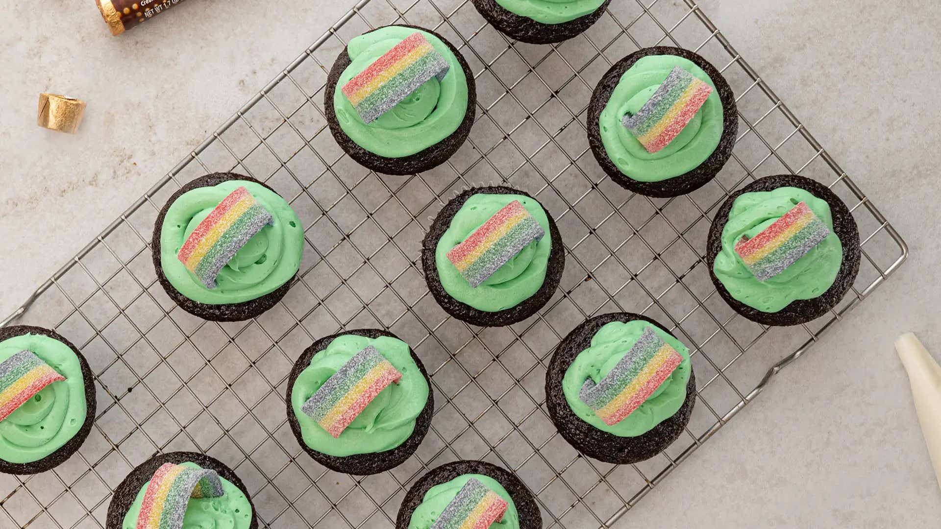 sour strip rainbos added onto cupcakes