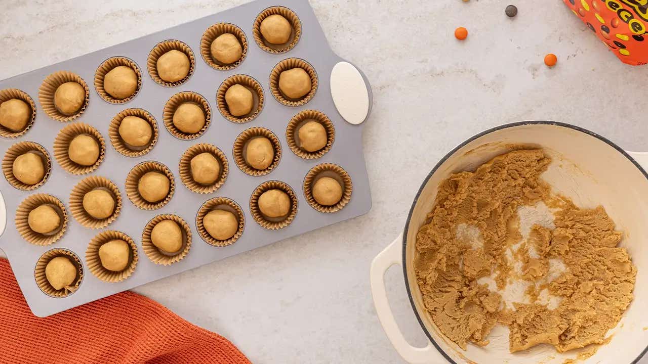 dough balls placed in muffin tin